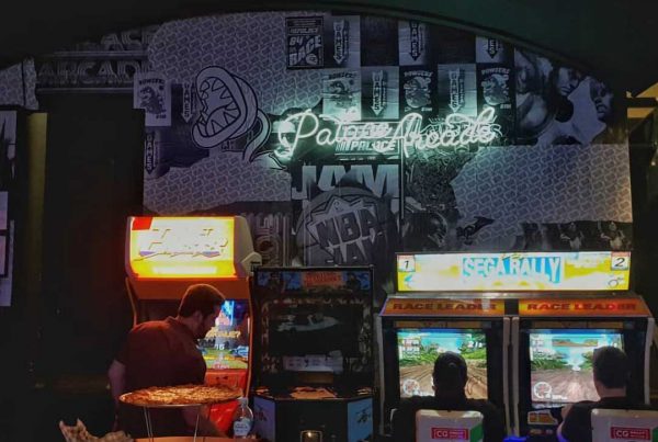 dark room in gaming bar with poster wall